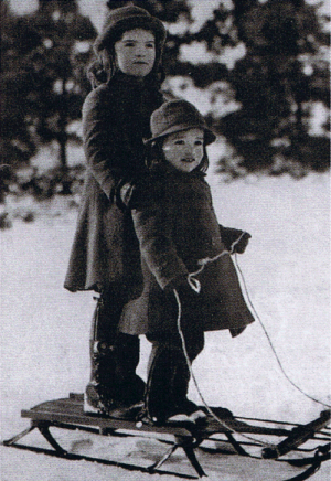 jackie bouvier kennedy onassis with sister lee in the snow as children.png